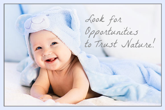Photo of happy baby with quote Look for opportunities to trust nature!